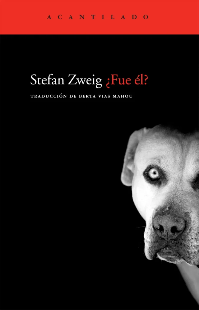 Portada de libro ¿Fue él? de Stefan Zweig con fondo negro y una franja roja superior; aparece media cara de un perro de mirada intensa en blanco y negro junto al título ‘¿Fue él?’ en letras blancas y rojas