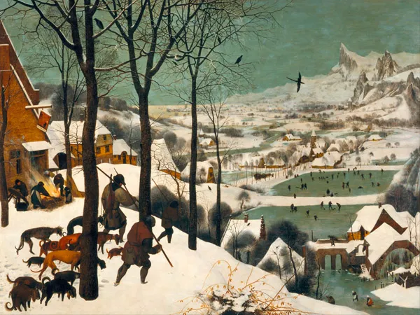 Escena invernal con cazadores y una jauría de perros avanzando por un bosque nevado, con campesinos alrededor de una hoguera, pintura de Pieter Brueghel el Viejo.